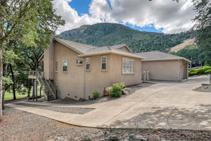 Side drive-way leads to 2nd 962 SF Garage