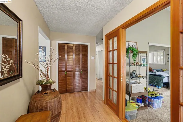 Wood-finish flooring throughout the hallway