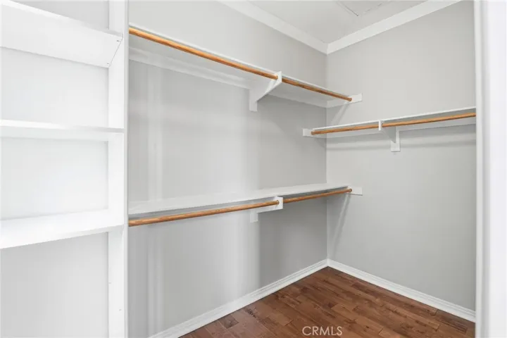 Primary bedroom walk in closet