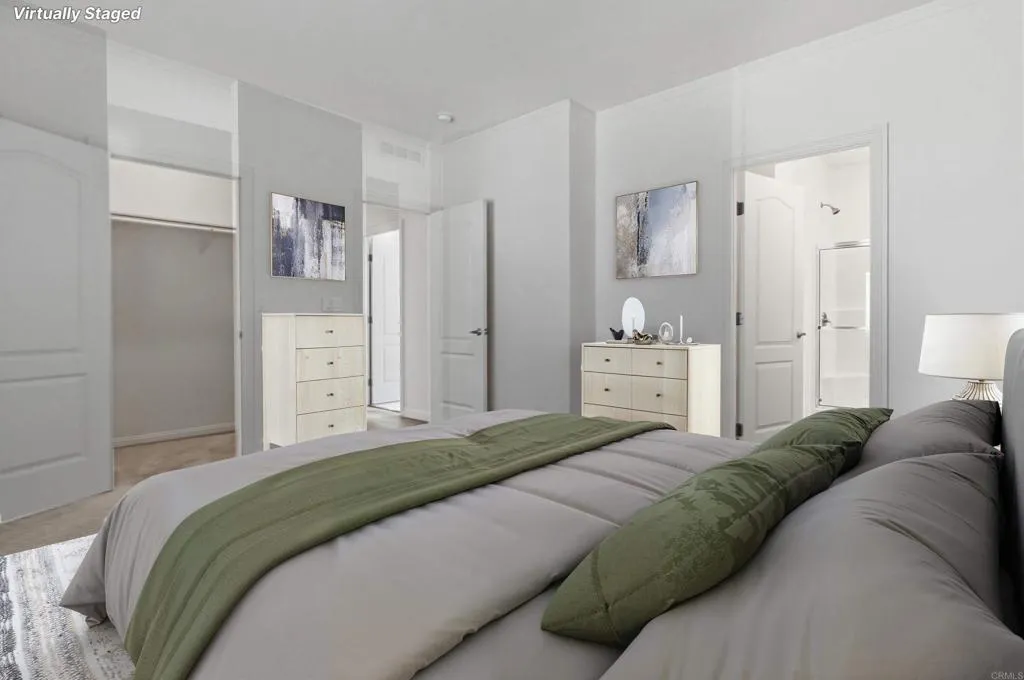 Virtually Staged Primary Bedroom with Walk-in Closet - see original photo