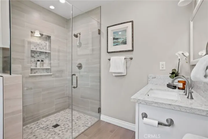 Beautiful tile shower with seemless glass doors