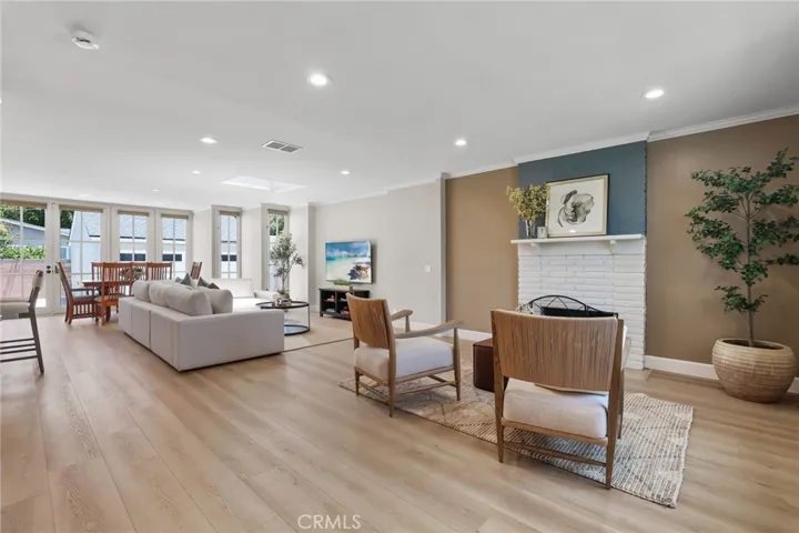 The living room/family room area gets lots of natural sunlight from the skylight and french doors and windows.