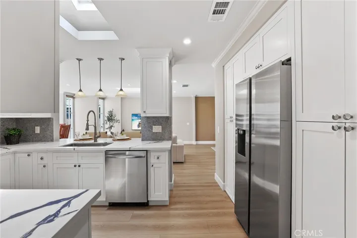 View of the kitchen from the hallway.  Easy access to the living room.