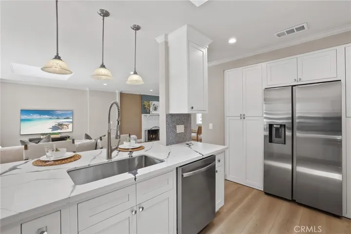 Kitchen is well appointed with stainless steel appliances and lots of storage.