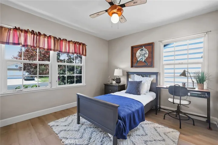 Guest Bedroom #1 is located at the front of the home with window views of the street.