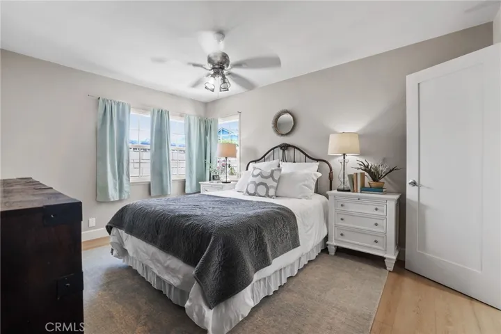 Primary suite is located at the back of the house.  Corner window gives lots of natural light.
