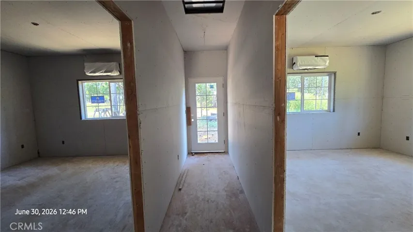 Hall to both bedrooms & backyard