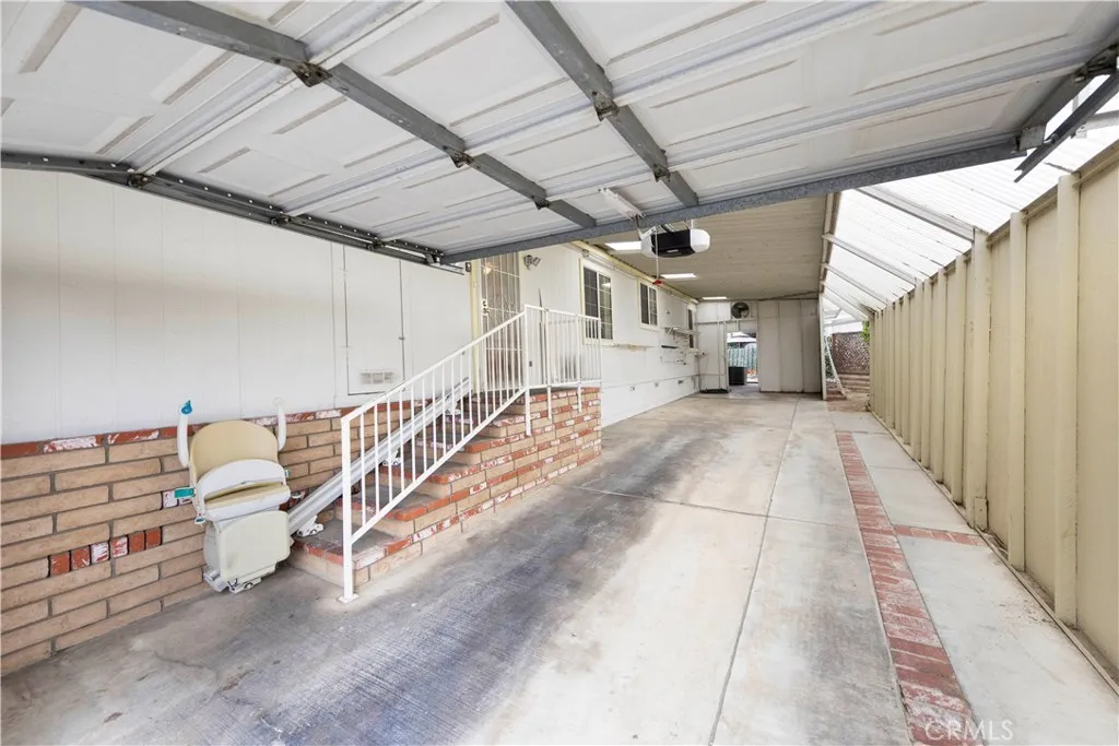 Large carport with garage door.