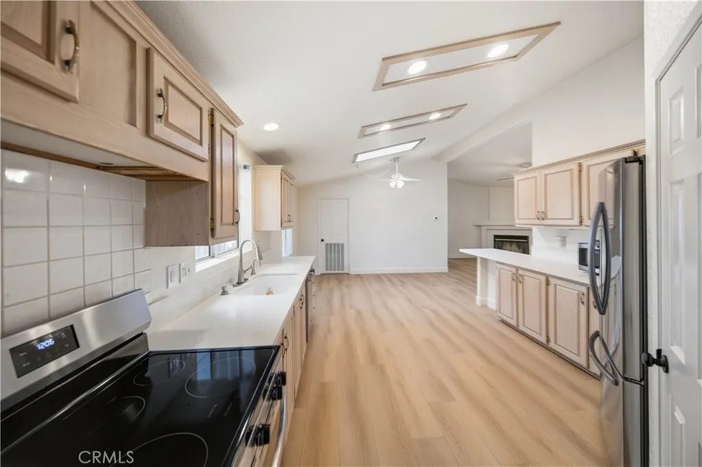 Large kitchen with plenty of cabinets.