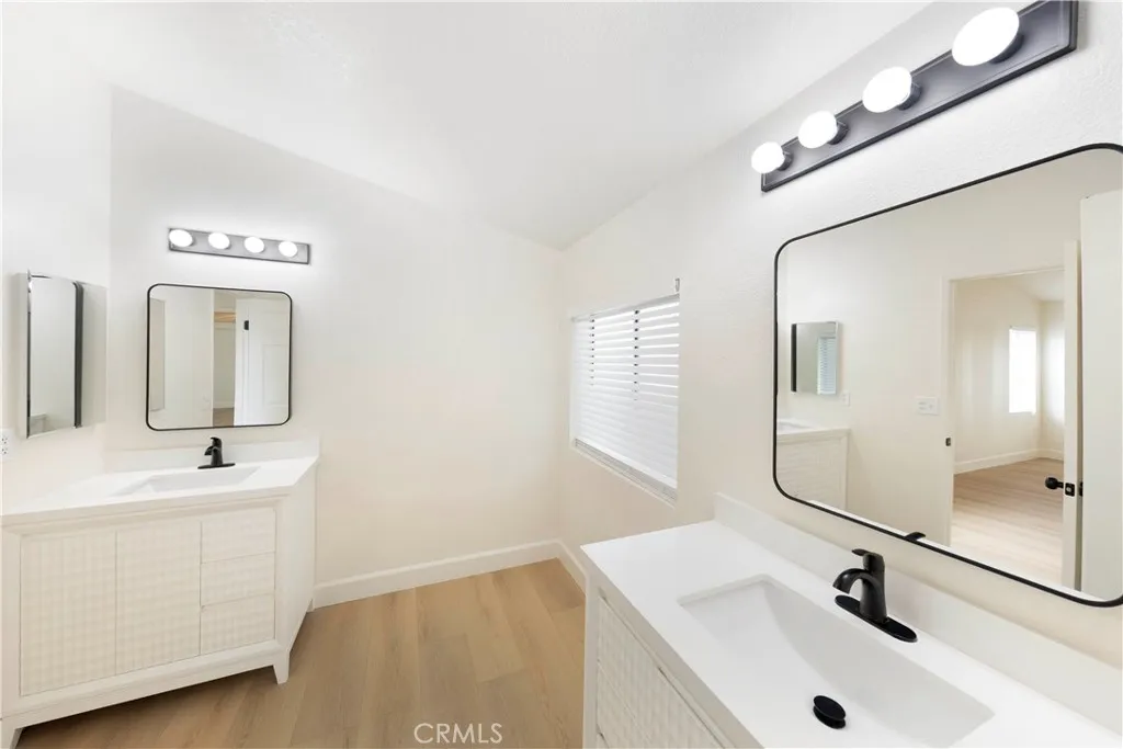 Primary bath with two vanities.