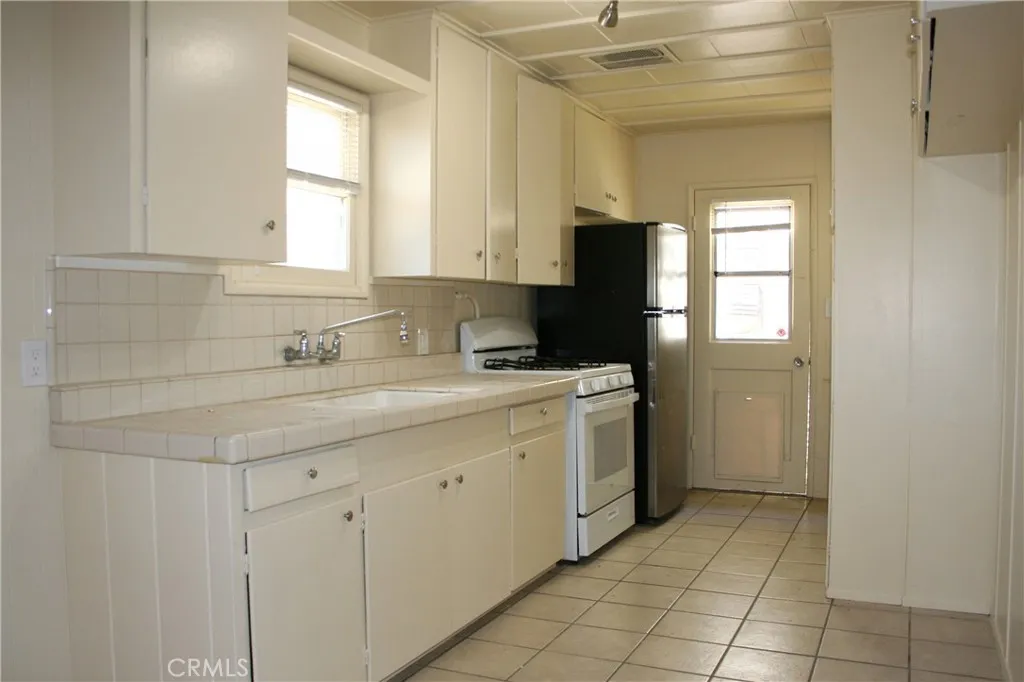 Kitchen with the door to the side yard