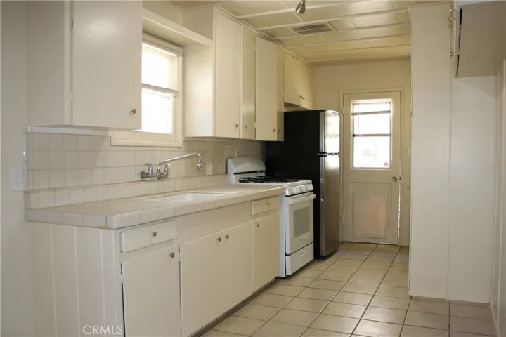 Kitchen with the door to the side yard