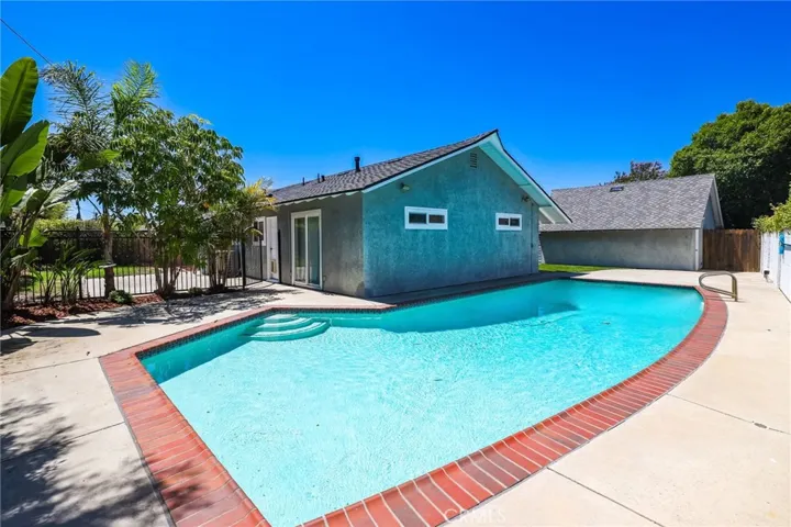 View pool fence between pool and backyard.