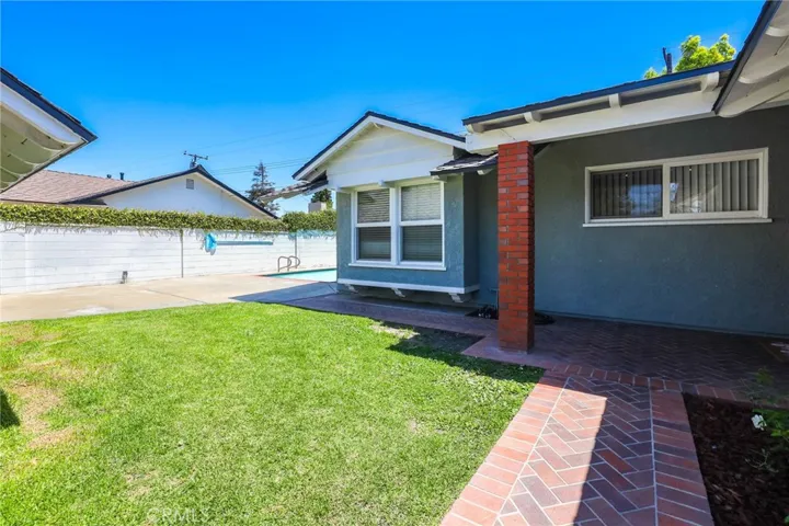 Private grass lawn with access to sparkling heated pool