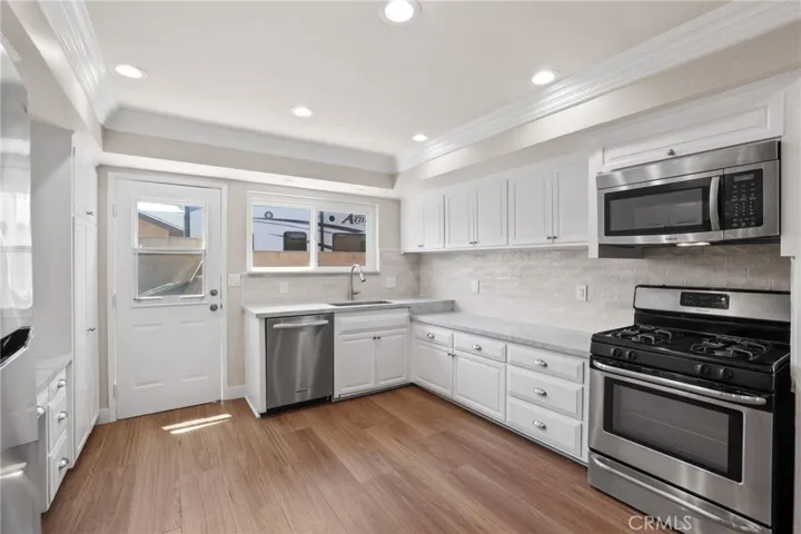 Ktchen has been recently updated with quartz counters, glazed porcelain subway backsplash.  It includes stainless steel appliances.