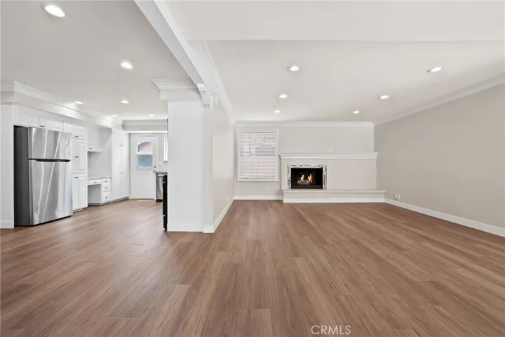 View from front door.  New laminate flooring throughout.  Living Room has cozy gas fireplace.  Kitchen has been recently updated.