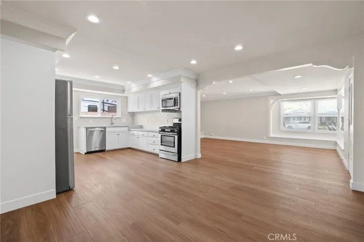 View of Kitchen and living room from hallway entry doorway