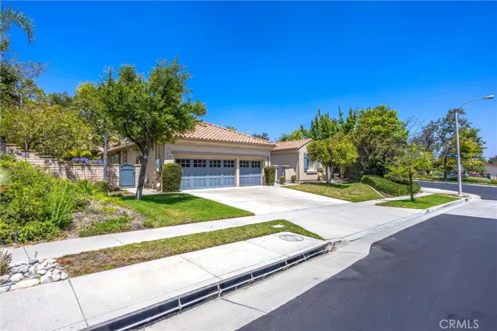 Three-car garage with spacious driveway parking