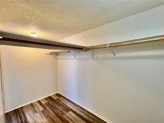 Primary bedroom walk in closet