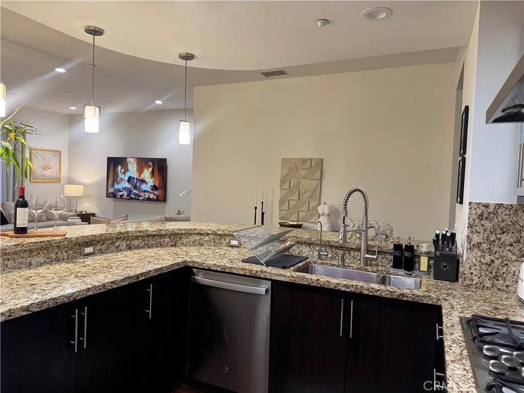 kitchen opens to the living and dinning area.
