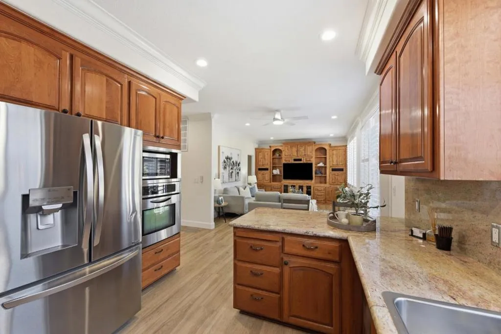 Kitchen with lots of counter space and stainless appliances.