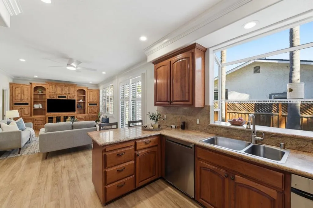 Breakfast bar and opens to the backyard and family room.