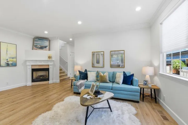 Beautiful open family room. New paint and new lighting. Hunter Douglas window coverings.