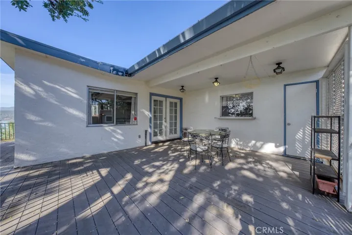 back deck french doors from living room and other door off kitchen