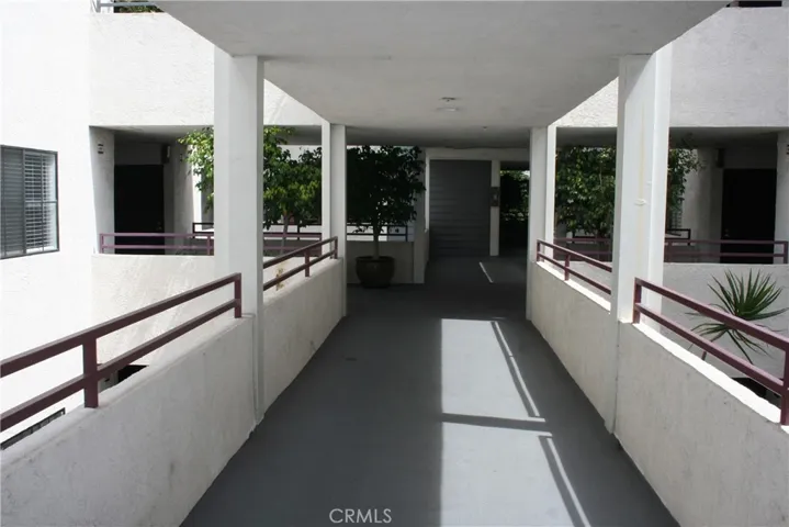 walk way leading to the unit which is on the left. Elevator at the end(back)
