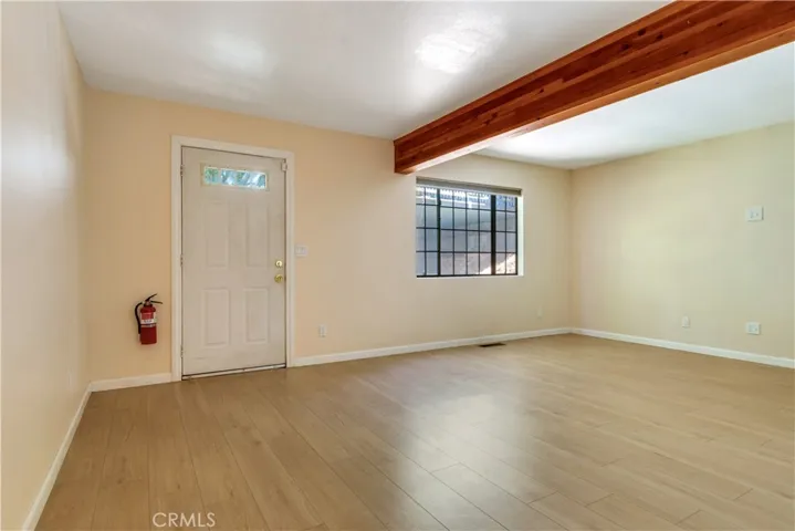 Lower level great room/Bedroom with exterior access to stairs to parking deck