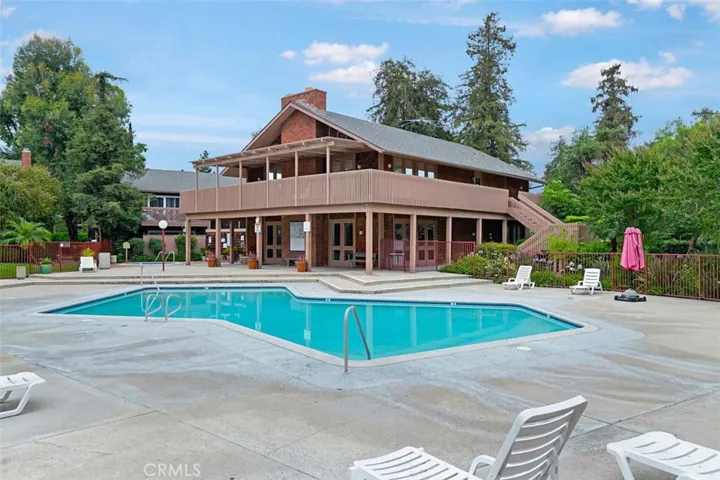 Community pool with a big beautiful clubhouse
