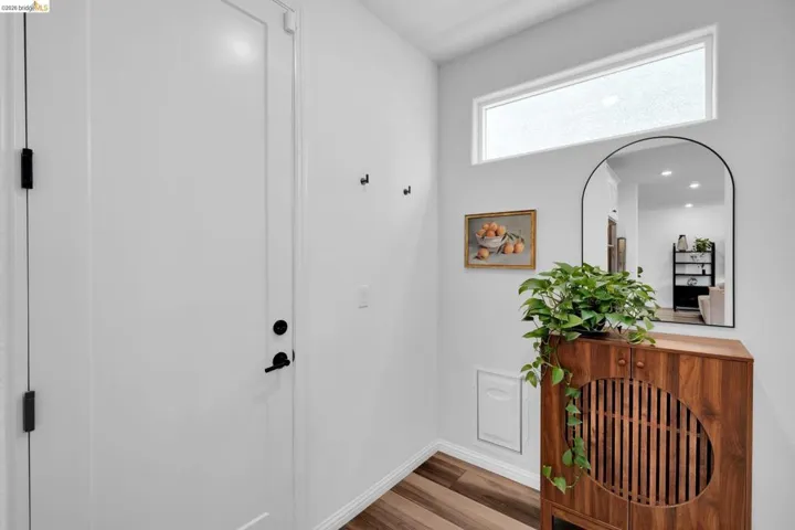White entry door with matte black hardware