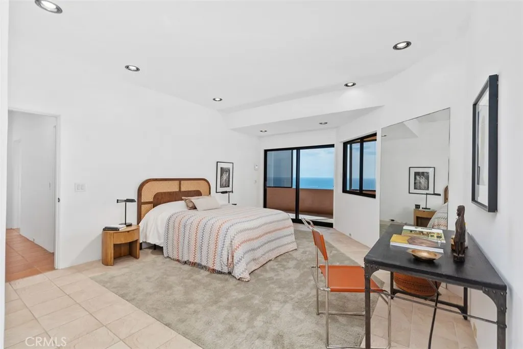 Second level largest bedroom (mirrored closet is not shown) also has slider to outer deck.