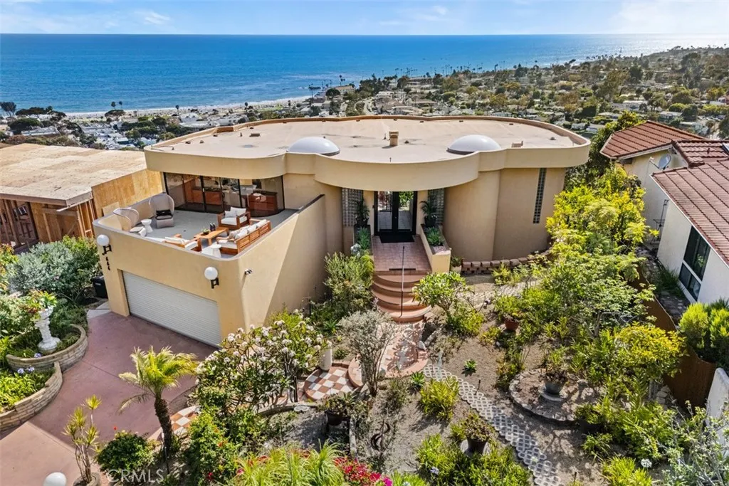 Exterior aerial photo of home, note large flat garden in  front