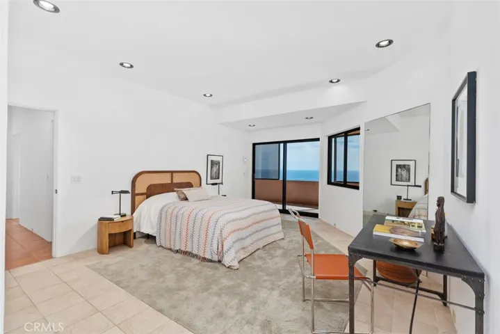 Second level largest bedroom (mirrored closet is not shown) also has slider to outer deck.
