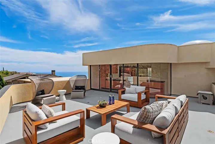 Upper deck over garage is large and great place to have a barbecue.