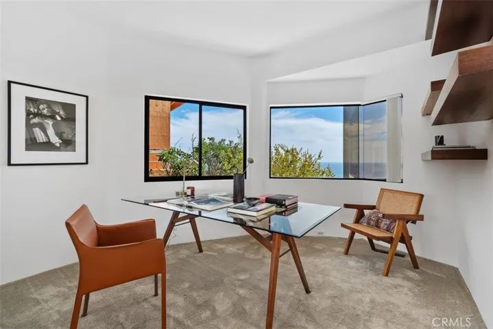 Second level has bedroom or office at bottom of stairs, closet is not shown but present.