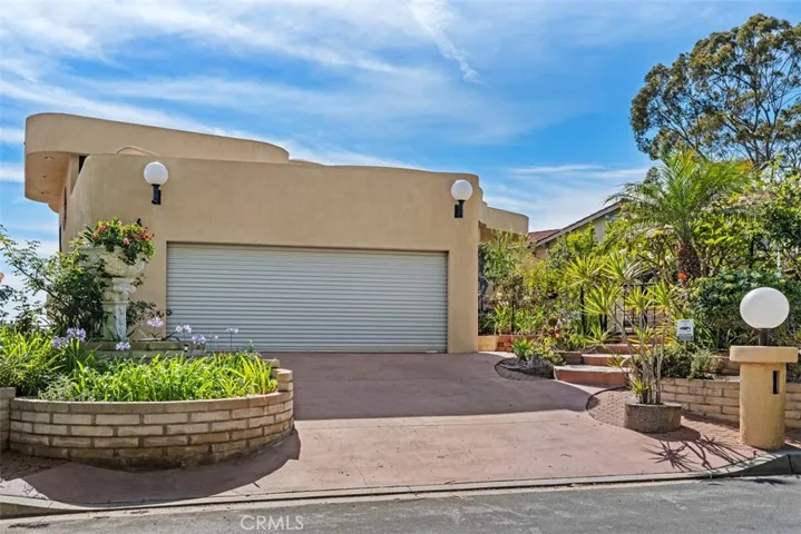 Driveway had planter added so only one car fits on driveway, could be modified to widen parking spaces.