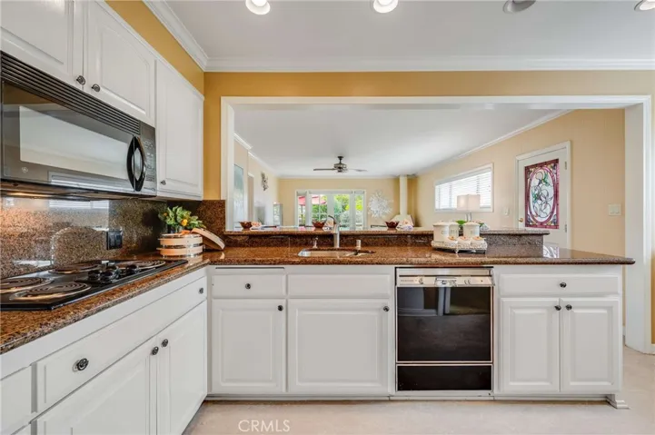 open floor plan to family room and backyard