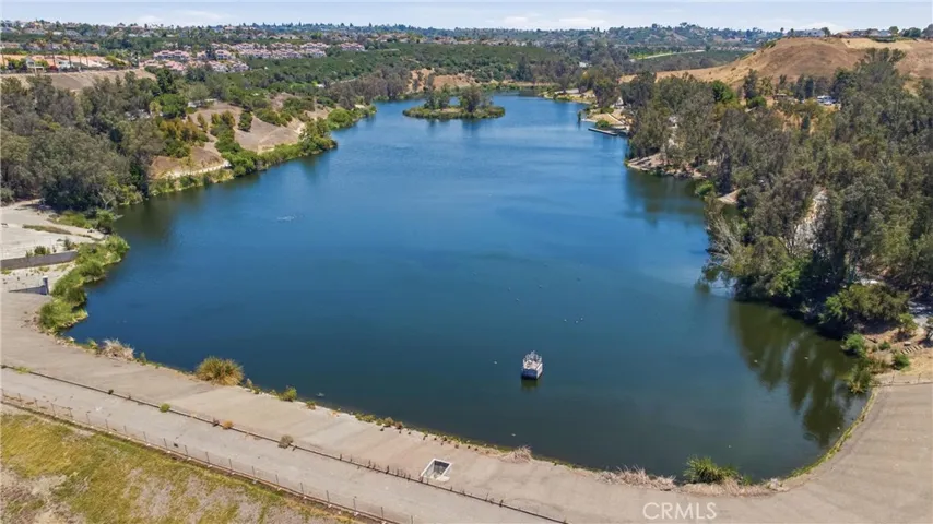 Picturesque lake, trails, and recreational courts located a few minutes away