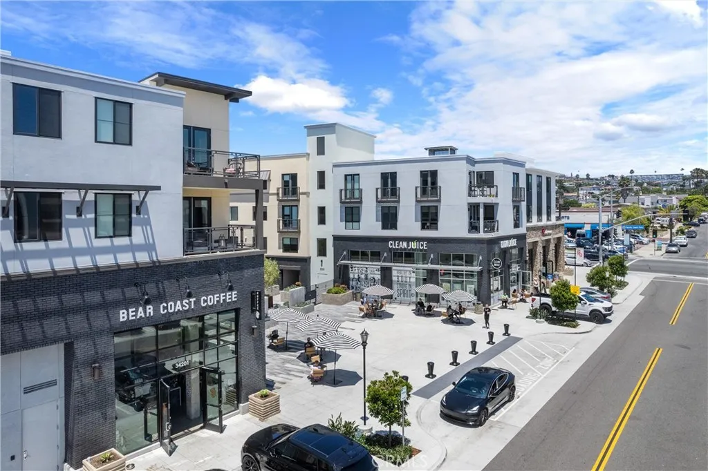 Enjoy your morning coffee at Bear Coast Coffee before exploring the boutiques, restaurants, and vibrant atmosphere of the Lantern District.