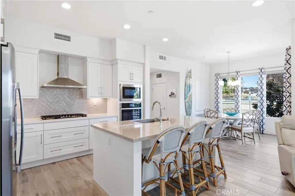 Gourmet kitchen offering generous prep space, abundant cabinetry, and designer finishes.