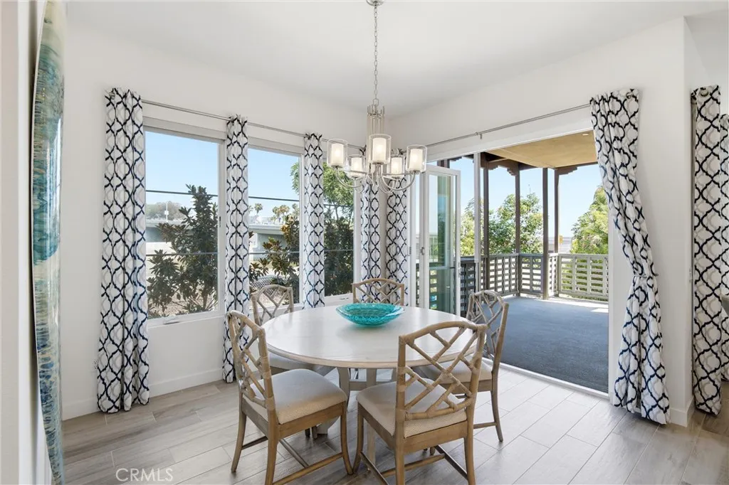 Indoor-outdoor living is effortless with folding glass doors opening to the covered patio.