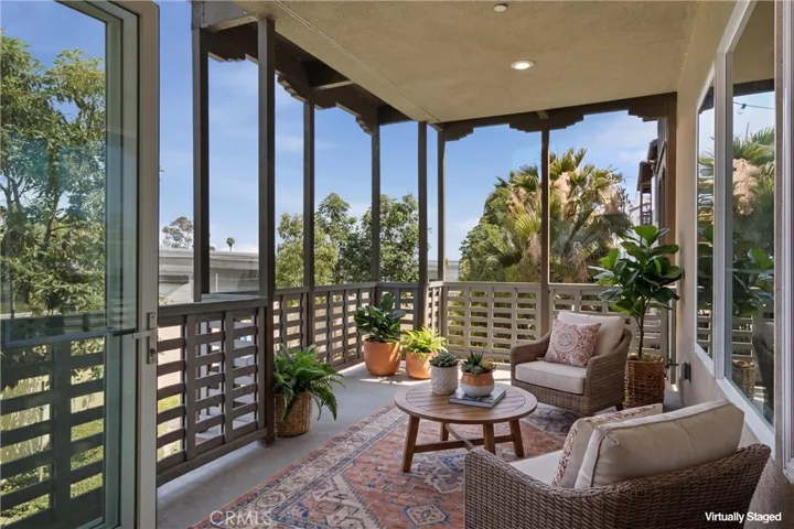 Virtually Staged Covered terrace provides the ideal space for outdoor dining, relaxing, or entertaining year-round.