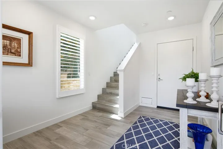 Welcome home to a bright, inviting entry with soaring ceilings and modern coastal finishes.