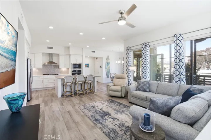 Open-concept living seamlessly connects the family room, kitchen, and dining area.