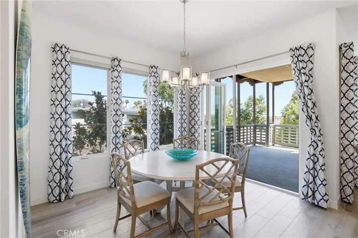 Indoor-outdoor living is effortless with folding glass doors opening to the covered patio.