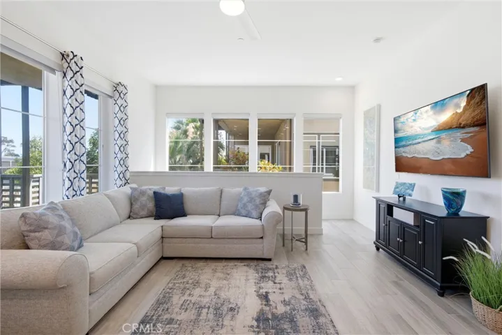 Spacious great room featuring abundant natural light and an open-concept layout.