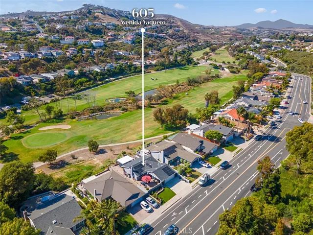 Overlooking the 9th fairway of Shorecliffs Golf Club with panoramic golf course and hillside views.