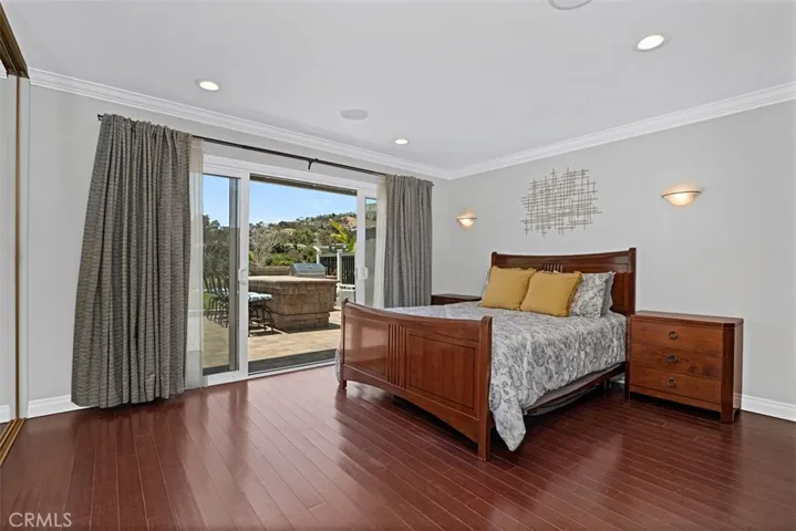 Wake up to sweeping golf course views from the spacious primary suite, complete with direct access to the patio.